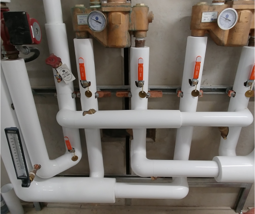 Jacketed hydronic lines finished around valves, gauges and balancing fittings.