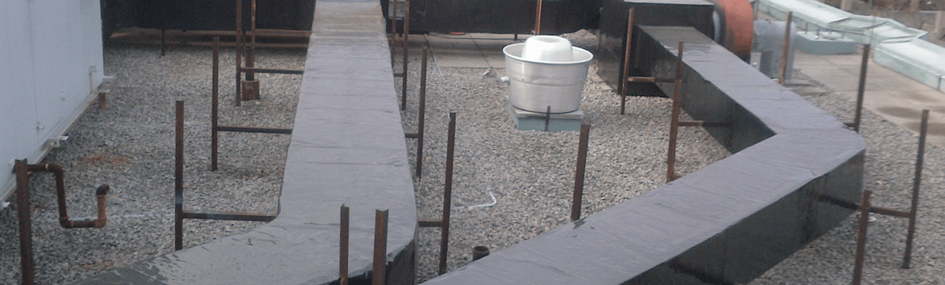 Exterior ductwork clad and sealed against weather and standing water.