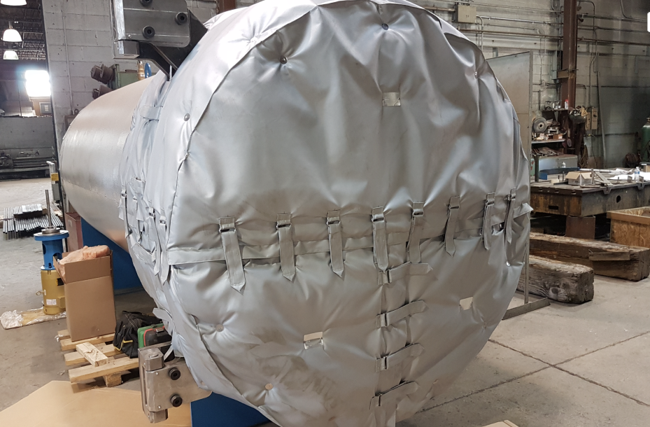 Strapped, re-usable cover fabricated to the vessel head so it can be pulled for service and refitted.